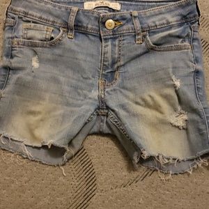 A pair of ripped denim shorts
